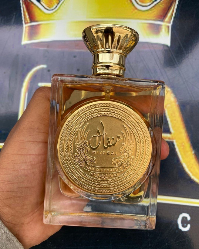 عطر ادوپرفیوم ارض الزعفران مدل مثقال رایحه شیرین ۱۰۰ میلیلیتر شرکتی